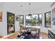 Cozy breakfast nook featuring a marble table, modern chairs, and access to an outdoor deck at 2947 Deer Point Dr, Seabrook Island, SC 29455
