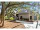 Charming home exterior showcases a pathway, well-manicured landscaping, and natural shade at 2947 Deer Point Dr, Seabrook Island, SC 29455