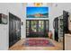 Grand foyer with high ceilings, striking artwork, and views through the double front doors at 2947 Deer Point Dr, Seabrook Island, SC 29455