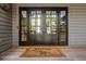 Stylish front entry with double doors and a welcome mat at 2947 Deer Point Dr, Seabrook Island, SC 29455
