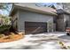 Exterior view of the home's garage showcasing a spacious driveway and well-maintained surroundings at 2947 Deer Point Dr, Seabrook Island, SC 29455