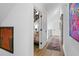 Hallway view to bedroom, with hardwood floors and decorative artwork at 2947 Deer Point Dr, Seabrook Island, SC 29455