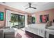 Bright main bedroom with balcony access, plush bedding, and stylish decor at 2947 Deer Point Dr, Seabrook Island, SC 29455