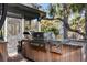 Outdoor kitchen with stainless steel grill and cabinetry, perfect for entertaining guests at 2947 Deer Point Dr, Seabrook Island, SC 29455