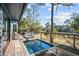 Inviting backyard deck with lounge chairs, built-in plunge pool, and tranquil waterfront views at 2947 Deer Point Dr, Seabrook Island, SC 29455