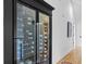 Built-in wine refrigerator with glass doors, showcasing an extensive wine collection at 2947 Deer Point Dr, Seabrook Island, SC 29455
