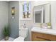 Modern bathroom featuring a stylish vanity, mirror, and tiled shower niche at 3 Coral Dr, Goose Creek, SC 29445