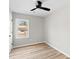A vacant bedroom with a window that lets in natural light and vinyl floors at 3 Coral Dr, Goose Creek, SC 29445