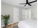 Well-lit bedroom with ceiling fan and closet doors at 3 Coral Dr, Goose Creek, SC 29445