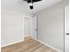 An empty bedroom with gray walls, new flooring, and a modern ceiling fan at 3 Coral Dr, Goose Creek, SC 29445