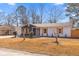 Charming single-story home featuring a well-maintained lawn and a cozy entrance, blending modern design with curb appeal at 3 Coral Dr, Goose Creek, SC 29445
