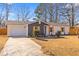 Lovely single-story home boasts an attached garage, mature trees, and a well-maintained lawn at 3 Coral Dr, Goose Creek, SC 29445