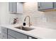 Close-up of a kitchen with elegant fixtures, countertops, and sleek cabinets at 3 Coral Dr, Goose Creek, SC 29445
