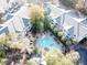 Aerial view of community with pool, green space, trees, and apartment buildings at 300 Bucksley Ln # 106, Charleston, SC 29492