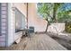 Wooden deck, table and chairs, a tree, and view of pink house, and central air conditioner at 313 Lapwing Ln, Mount Pleasant, SC 29464