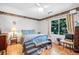 Cozy bedroom with a bed, hardwood floors, and large window, offering a peaceful space to relax and unwind at 313 Lapwing Ln, Mount Pleasant, SC 29464