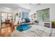 Bright bedroom with multiple windows, offering natural light and workspace, combining relaxation and productivity at 313 Lapwing Ln, Mount Pleasant, SC 29464