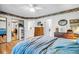 Spacious bedroom with a large bed, hardwood floors, and vintage furniture, creating a timeless and inviting space at 313 Lapwing Ln, Mount Pleasant, SC 29464