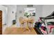 Cozy dining area with a wooden table, bar stools, and view to the kitchen, a great spot for a quick meal at 313 Lapwing Ln, Mount Pleasant, SC 29464
