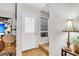 Entryway with a white door, window with blinds, and a decorative table lamp, offering a welcoming entrance at 313 Lapwing Ln, Mount Pleasant, SC 29464