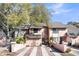 Charming townhome with brick-lined driveway and lush landscaping in a desirable neighborhood with mature trees at 313 Lapwing Ln, Mount Pleasant, SC 29464