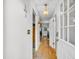 Inviting hallway featuring hardwood floors, neutral walls, and a well-lit entry to the home at 313 Lapwing Ln, Mount Pleasant, SC 29464