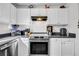 Modern kitchen with white cabinets, stainless steel oven, and plenty of storage and prep space at 313 Lapwing Ln, Mount Pleasant, SC 29464
