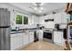 Well-maintained kitchen with white cabinets, stainless steel appliances, and ample counter space at 313 Lapwing Ln, Mount Pleasant, SC 29464