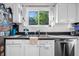 Bright kitchen with white cabinets, stainless steel appliances, and a view of the outdoor through the window at 313 Lapwing Ln, Mount Pleasant, SC 29464