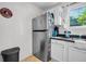 Efficient kitchen with stainless steel refrigerator and white cabinetry, perfect for everyday meals at 313 Lapwing Ln, Mount Pleasant, SC 29464