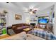Cozy living room featuring hardwood floors, a fireplace, and lots of natural light at 313 Lapwing Ln, Mount Pleasant, SC 29464