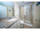 Well-lit bathroom features granite countertop, sleek fixtures, and glass shower at 393 Flyway Rd, Goose Creek, SC 29445