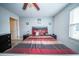 Comfortable bedroom features a ceiling fan, neutral walls, and an inviting striped comforter set at 393 Flyway Rd, Goose Creek, SC 29445