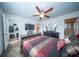 Well-lit bedroom includes a ceiling fan, television, and a walk-in closet at 393 Flyway Rd, Goose Creek, SC 29445