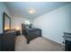 Neutral bedroom features carpet flooring, a large bed, and a dresser with mirror at 393 Flyway Rd, Goose Creek, SC 29445