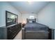 Bright bedroom with carpet flooring, a large bed, dresser and mirror at 393 Flyway Rd, Goose Creek, SC 29445