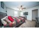 Bright bedroom featuring a ceiling fan, television, and a striped comforter at 393 Flyway Rd, Goose Creek, SC 29445