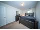 Bright bedroom featuring carpet flooring, a large bed, and a dresser with mirror at 393 Flyway Rd, Goose Creek, SC 29445