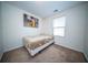 Neutral bedroom with a comfortable bed and a window letting in natural light at 393 Flyway Rd, Goose Creek, SC 29445