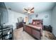 Cozy bedroom with ceiling fan, carpet flooring, and dark wood bedroom furniture at 393 Flyway Rd, Goose Creek, SC 29445
