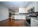 Modern kitchen featuring stainless steel appliances and granite countertops, open to living area at 393 Flyway Rd, Goose Creek, SC 29445
