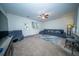 Bright living room featuring modern furniture, a large rug, and a rear entrance door at 393 Flyway Rd, Goose Creek, SC 29445