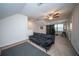 Spacious upstairs living room with a ceiling fan, partition screen, and comfortable seating at 393 Flyway Rd, Goose Creek, SC 29445