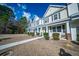 Charming townhomes featuring tidy landscaping, inviting entrances, and classic architectural designs at 393 Flyway Rd, Goose Creek, SC 29445