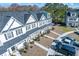 Aerial view of townhomes showcasing neat landscaping, private entrances, and resident parking at 393 Flyway Rd, Goose Creek, SC 29445