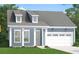 Charming single-story home featuring a welcoming facade, gray roof, and an attached two-car garage at 422 Evening Glow Ln, Summerville, SC 29486