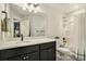Clean bathroom with a shower/tub combo and dark vanity at 5135 Park Creek Avenue, North Charleston, SC 29418