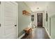 Bright entryway with green walls, wood bench, and coat rack at 5135 Park Creek Avenue, North Charleston, SC 29418