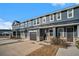Townhomes with gray siding, stone accents and garages at 5135 Park Creek Avenue, North Charleston, SC 29418