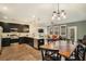 Open concept kitchen and dining area with modern cabinetry and island at 5135 Park Creek Avenue, North Charleston, SC 29418